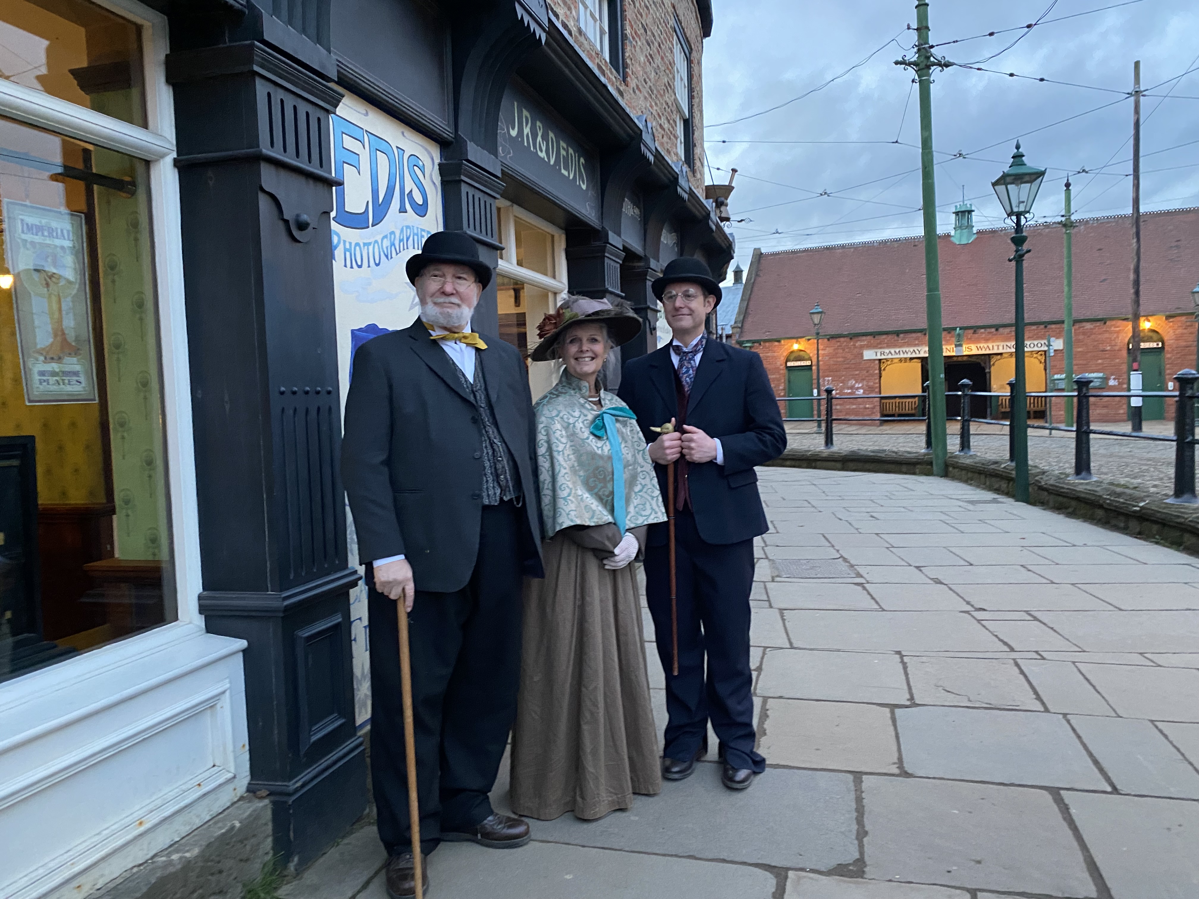 Mike, Janice and Matt Baker stand outside JR & D Edis Photographers dressed in Edwardian costume as part of the filming for Matt Baker: Travels with Mum and Dad